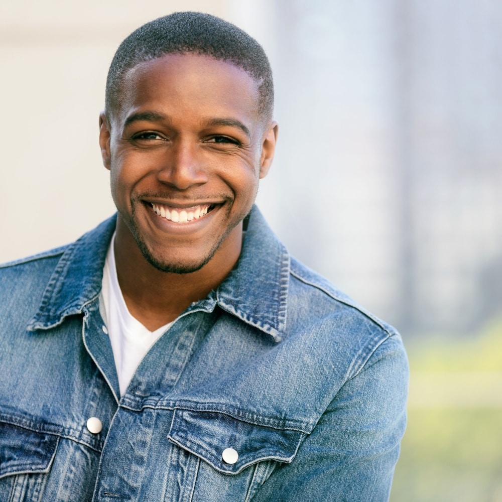 Smiling man in a denim jacket